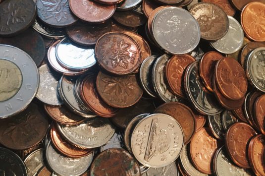 A pile of Canadian coins, tax changes Canada.