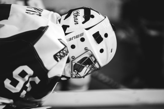 Side view of a hockey players.