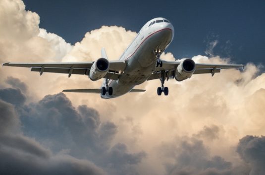 An airplane in the sky representing a commercial pilot in tax dispute with CRA