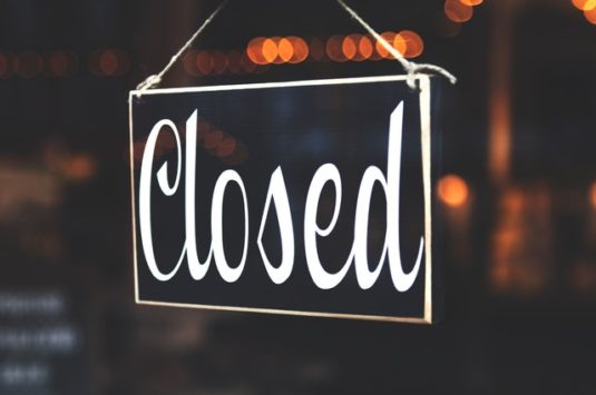 A closed sign in a doorway