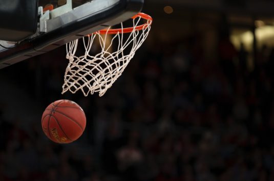 A basketball and hoop representing the start of the 2020 NBA season during COVID-19